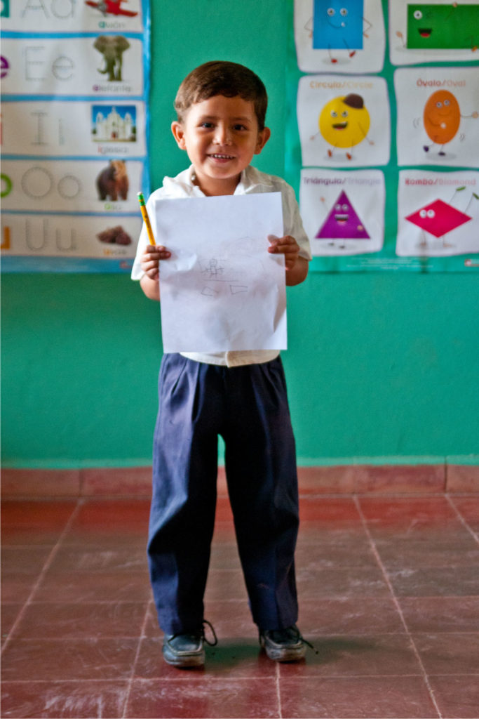 little boy holding schoolwork | Clean Water in Honduras | Where We Work | Water For People