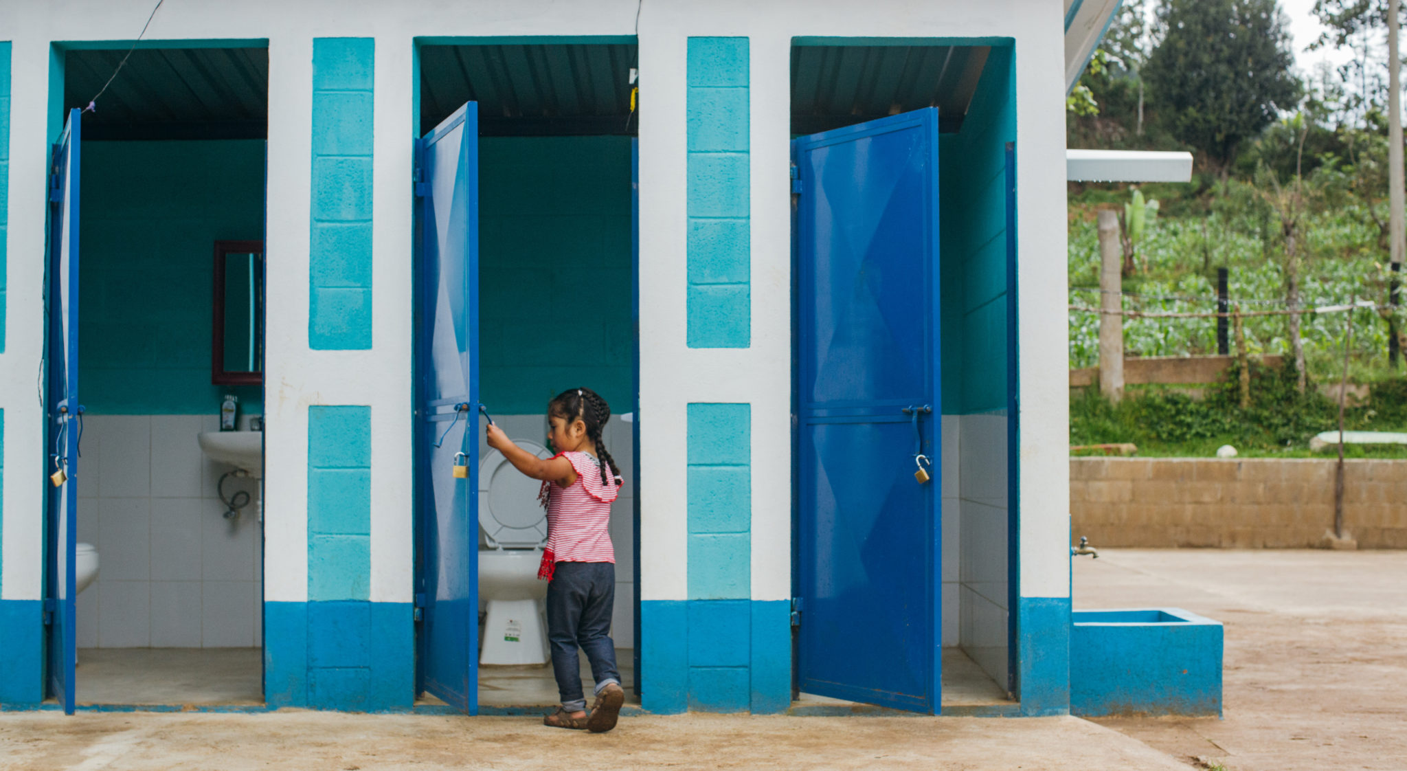 little girl going to a clean bathroom | This is What Sanitation Can Do | Water For People