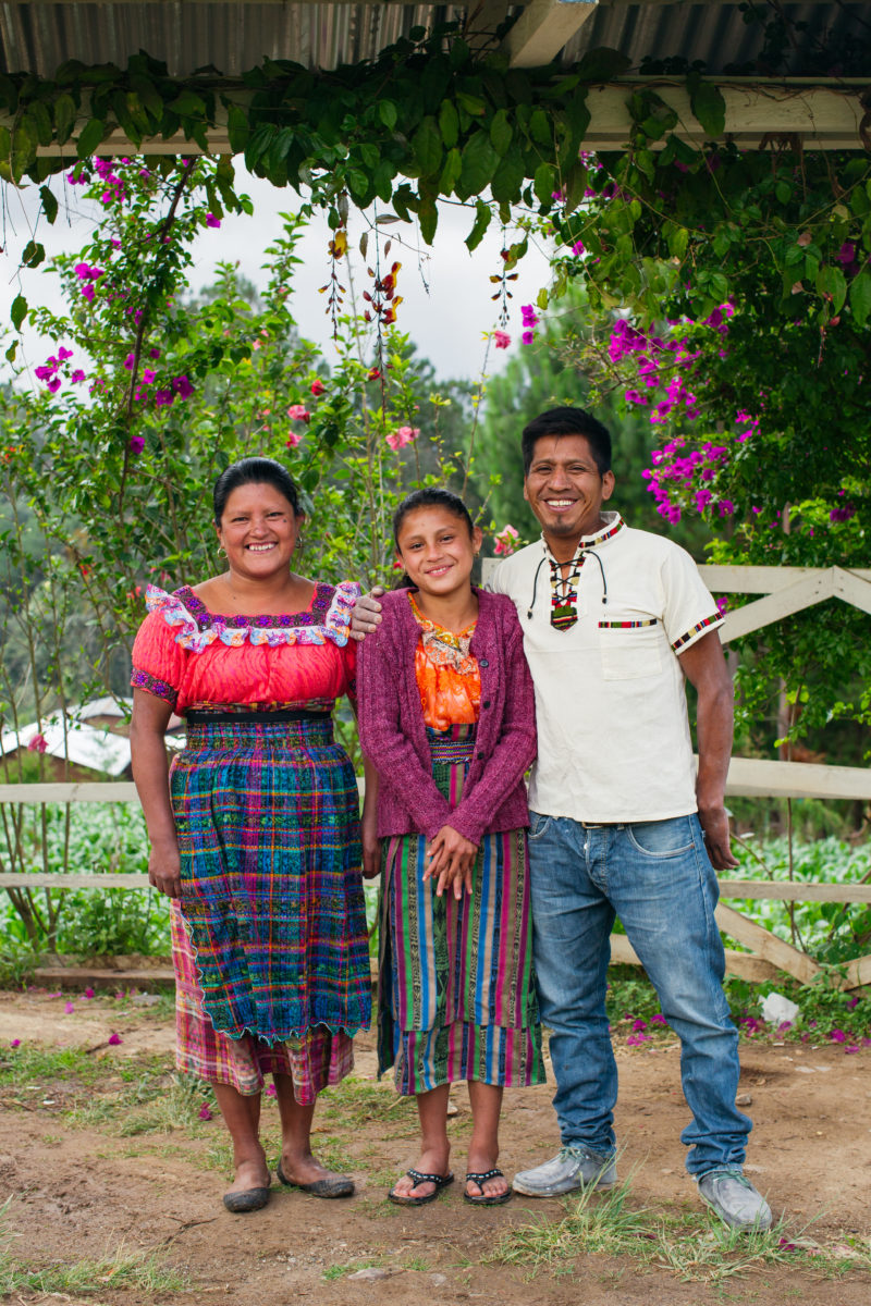 Man and two women, smiling