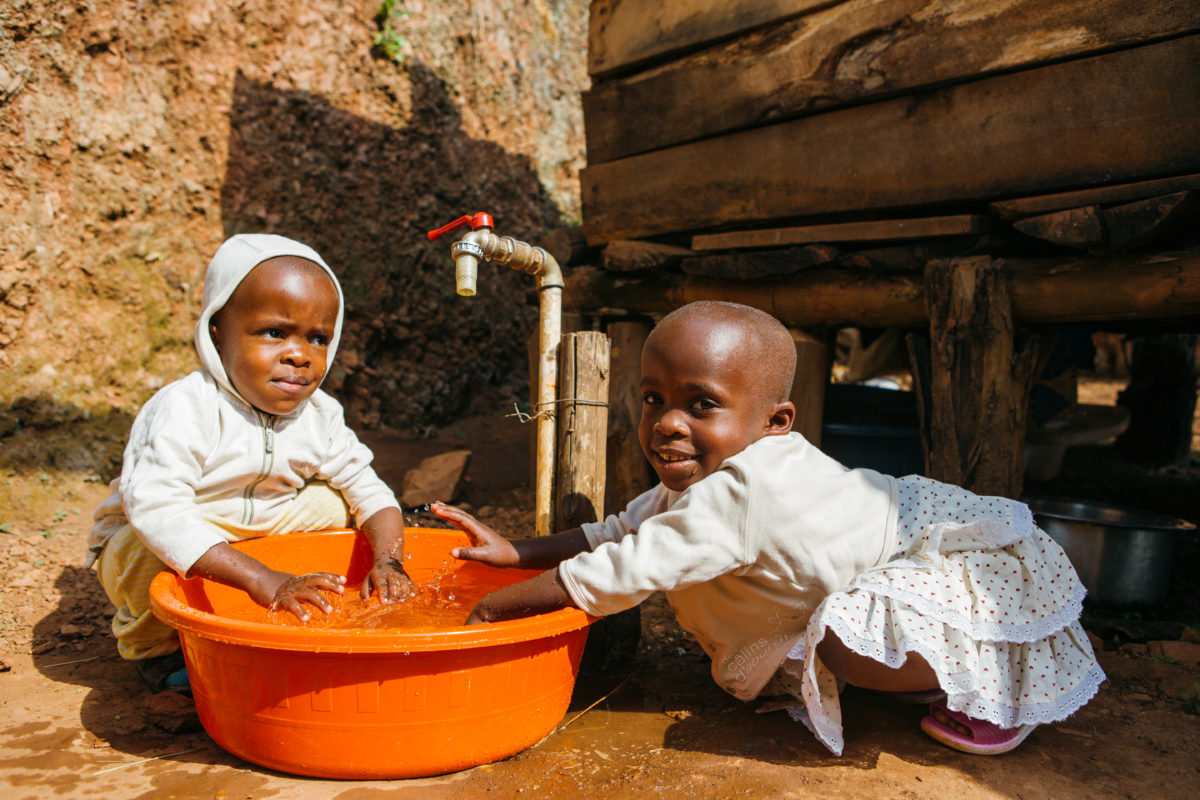 Two children playing in water 