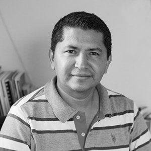HenryGudiel CD Photo of a man in striped shirt smiling at the camera