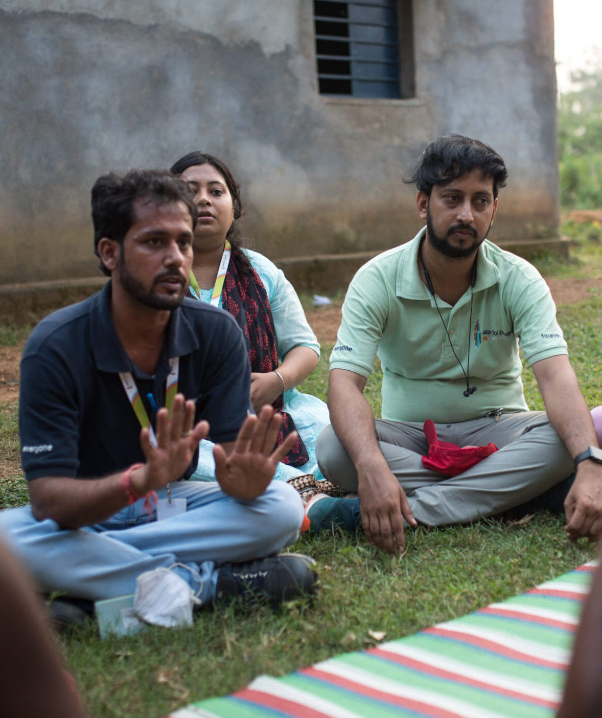 Water For People India team members meet with a community in Birbhum, India