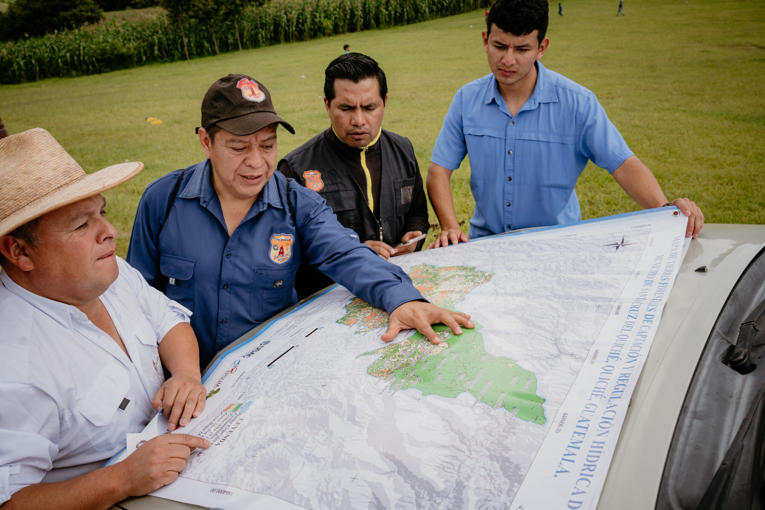 Water For People team members in Guatemala discuss watersheds and water source protection with community members.