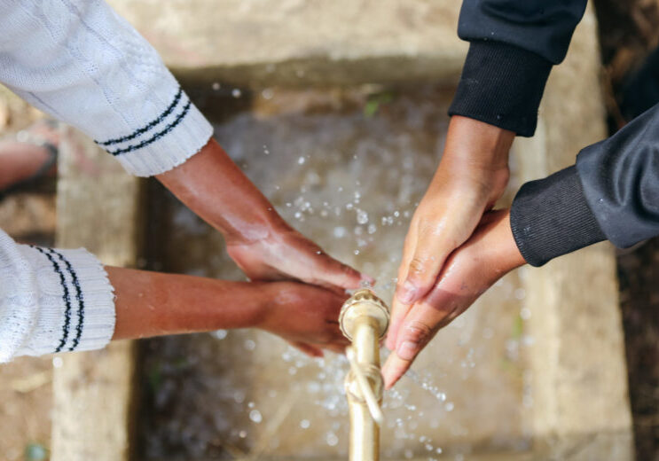 washing hands together | Water For People Jobs | Careers | Water For People