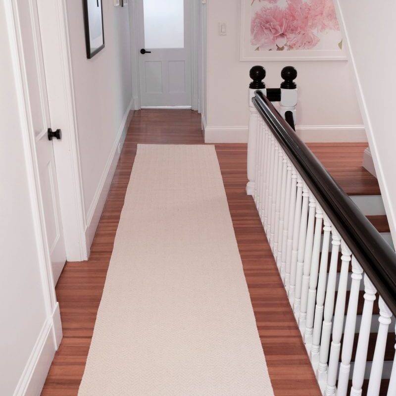 Photo of a hallway and a carpet runner made by company Hook & Loom.