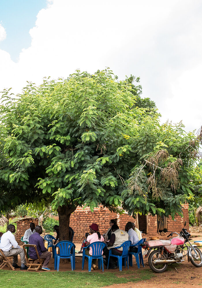 Water For People and community leaders gather for a meeting in Luuka, Uganda