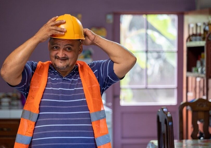 Sixto prepares for work at his sanitation business in Honduras.